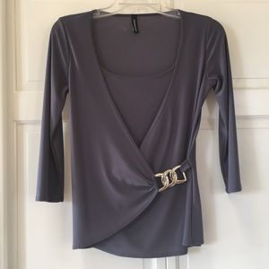 Faux wrap top with silver accent. Size S
